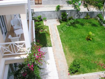 apartment caprice mauritius garden view from balcony view
Caprice Apartment garden view from balcony. On the balcony there are two chairs and a table. There are plants and flowers growing in the garden and there is a pathway around the small garden.
Keywords: Caprice Apartment, balcony, garden, plants, flowers, tables, chairs, pathway