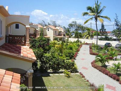 standard apartments trou d?ǨѢeau douce mauritius ref 180 view from balcony
Standard Apartments Trou D?ǨѢeau Douce Mauritius Ref 180 view from balcony. The apartments look out onto the garden and parking area. The garden has a path way, palm trees, plants.  It is situated in close proximity to one of the nicest beaches of Mauritius, within walking distance to the village centre of Trou D?ǨѢEau Douce in the northeast of the island and about 40 minutes from the airport. 
Keywords: Les Badamiers Apartment, balcony, garden, parking, pathway, palm trees, plants, beach, village, Trou D'Eau Douce