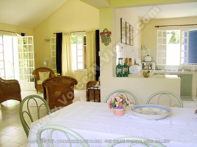 beach villa hibiscus mauritius dining room view
Hibiscus Beach Villa dining room, living room and kitchen view. The dining room has a dining table and looks into the kitchen and living room. The kitchen is fully equipped with all cooking utensils including plates, glasses, knives & forks, gas cooking stove & oven, fridge, toaster, kettle & coffee maker. The living room has cane furniture, a television and a small mini Hi-Fi.
Keywords: Hibiscus Beach Villa, dining room, living room, kitchen, table, cooking utensils, plates, glasses, knives, forks, gas stove, oven, fridge, toaster, kettle, coffee maker, cane furniture, television, hi-fi