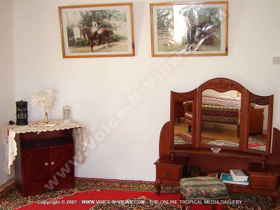 guest house les palmiers chamarel mauritius room view
Les Palmiers Chamarel GuestHouse bedroom view is furnished with a wooden dressing table and cabinet. On the wall are laminated pictures to give decoration to the room.
Keywords: Les Palmiers Chamarel guesthouse, bedroom,wooden furniture,laminated pictures.
