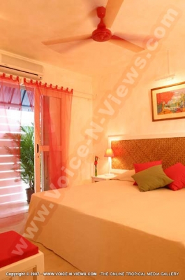 sous le badamier mauritius deluxe room and balcony view
