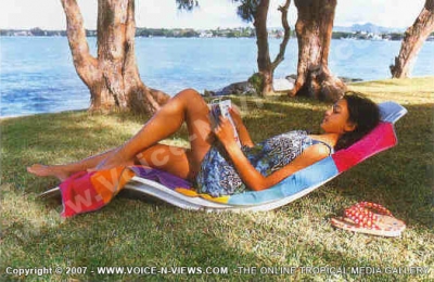 filao village hotel lady relaxing in sunbed
