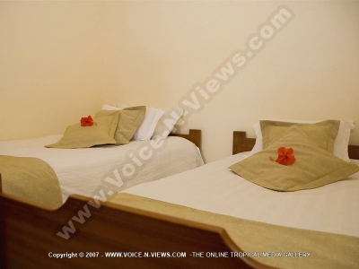twin bedroom of le palmiste resort and spa
