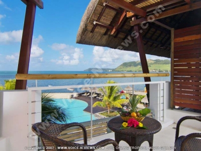 laguna beach hotel and spa mauritius room balcony with swimming pool and sea view
