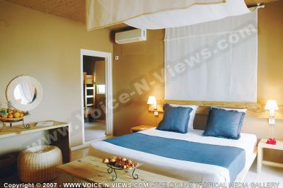 3 star hotel pointe aux biches hotel room
The 3*Pointe Aux Biches Hotel bedroom. The rooms are furnished in comfortable, easy and rustic style, with a decoration of natural materials such as cane and wood. Shades of beige and brown prevail, representing a nice contrast with the lively colours of the island and the ocean.  Has a double bed with bed side tables on each side as well as lamps. There is an air condition in the room. On the dressing table, a bowl of fruit awaits the guests.
Keywords: 3*hotel, bedroom, furnished, comfortable, rustic, decoration, natural, cane, wood, beige, brown, island, ocean, double bed, air condition, lamps, bedside tables, fruit