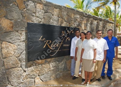 le recif hotel mauritius staff in front of the hotel
