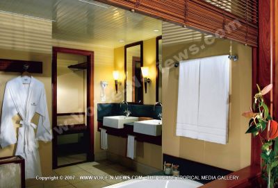 4 star heritage awali golf & spa resort deluxe 4
The deluxe bathroom is decorated in white and beige. The bathroom is equipped with bath and hand towels, dressing gown and hairdryer for guests use. There are mirrors over the basins. An opening in the bathroom wall looks onto the bedroom and the blinds can be drawn down for privacy.
Keywords: 4*hotel, deluxe, bathroom, white, beige, bath tub, bath towels, dressing gown, hairdryer, blinds, mirrors