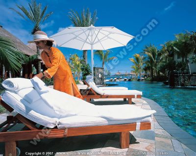 5 star hotel  le touessrok resort beach waitress
