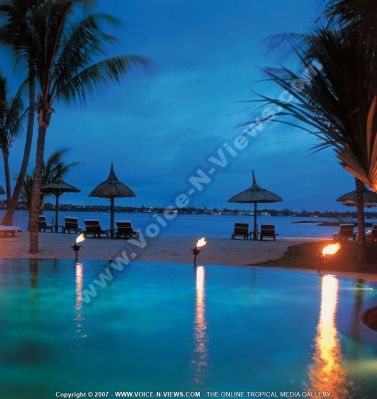 5 star hotel  le touessrok resort frangipani island pool night
