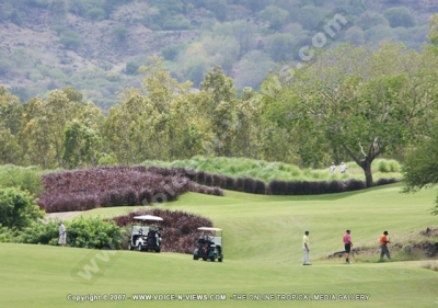 tamarina golf spa and beach club mauritius club car golfers and general view

