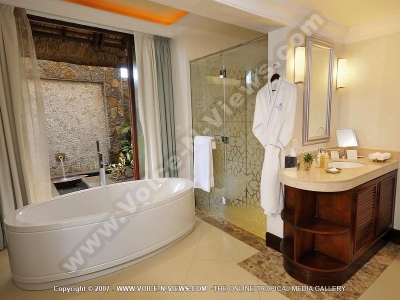 the grand mauritian a luxury collection resort and spa mauritius courtyard junior suite bathroom
