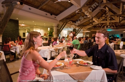 pearle beach resort & spa mauritius guests having diner at the restaurant
