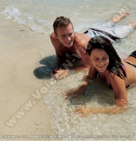 pearle_beach_hotel_mauritius_young_couple_smiling_and_lying_on_the_beach.jpg