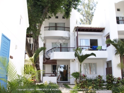 apartment beach club mauritius garden and front view
