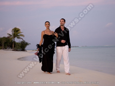 diva maldives hotel maldives couple having a walk on the beach
