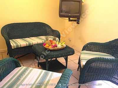 apartment beach club mauritius living room view
Beach Club Apartment living room view. The living room has green furniture; sofas and coffee table on which lies a beautiful display of fruit. There is also a television in the living room.
Keywords: Beach Club Apartment, living, room, green, furniture, sofas, coffee, table, fruit, television