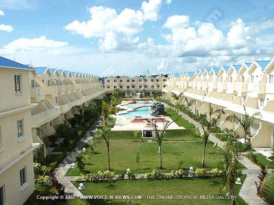 apartment latanier mauritius aerial view
Latanier Apartment aerial view. These self catering holiday apartments are located in a building complex with a pool and furnished in contemporary style. All the apartments are garden facing. The garden boasts a beautiful swimming pool, palm trees, plants, lights along the path which come on at night.
Keywords: Latanier Apartment, view, self-catering, building, furnished, contemporary, style, swimming pool, palm trees, garden, plants, lights
