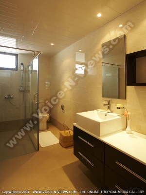 grand bay suites spacious bathroom with shower and toilet
