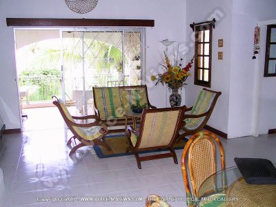 budget guesthouse pointe d'esny mauritius ref 165 living room view
Budget Guesthouse Pointe d'Esny Mauritius Ref 165 living room view. The dining room is just off the living room and has a dining table and chairs. The living room has wooden furniture and table. It has a view of the terrace, which is furnished with tables and chairs and overlooks the garden.
Keywords: Noix de Coco, living room, chairs, dining table, terrace, artificial flowers