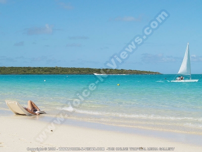 lady in sunbed at pointe desny beach mauritius
