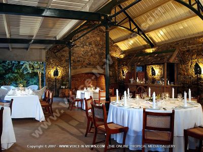guest house eureka house mauritius restaurant view
Eureka guesthouse restaurant. Le Ravin restaurant, as it is known as, is situated near the river and offers dinner three times a week; every Tuesday, Thursday and Saturday, and for the other evenings dinner can be prepared for guests to serve themselves making use of the kitchenette.  The tables in the restaurant are set with plates, knives, forks, glasses and napkins. 
Keywords: Eureka guesthouse, restaurant, river, tables, plates, knives, forks, glasses, napkins