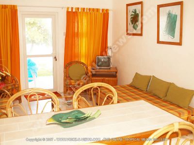 guest house tropicana mauritius living room view
Tropicana guesthouse living room view. The living room is decorated in orange. It has varnished wooden furniture, a spare bed, a television. The living room looks onto the dining room. It also leads out onto a terrace.
Keywords: Tropicana guesthouse, living room, dining room, orange, white, veranda, t.v, furniture, bed, terrace