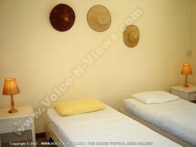 beach villa jean francois mauritius single room view
Jean Francoise Beach Villa single room. This room, like the master bedroom, is also located on the first floor. It has twin beds with a sea view and is equipped with a fan. The room shares a bathroom with the master bedroom.
Keywords: Jean Francoise Beach Villa, single, first floor, twin beds, sea, fan, bathroom