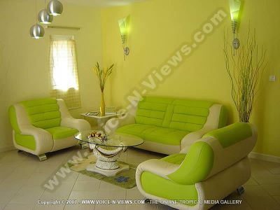 villa 4 heavens mauritius livingroom view
The ground floor of the Four Heavens Villa consists of the lounge, kitchen and dining room.  The lounge has green and white sofas with a glass coffee table. There are overhead green lights, as well as artificial plants.
Keywords: Four Heavens Villa, living room, green, sofas, coffee table, lights